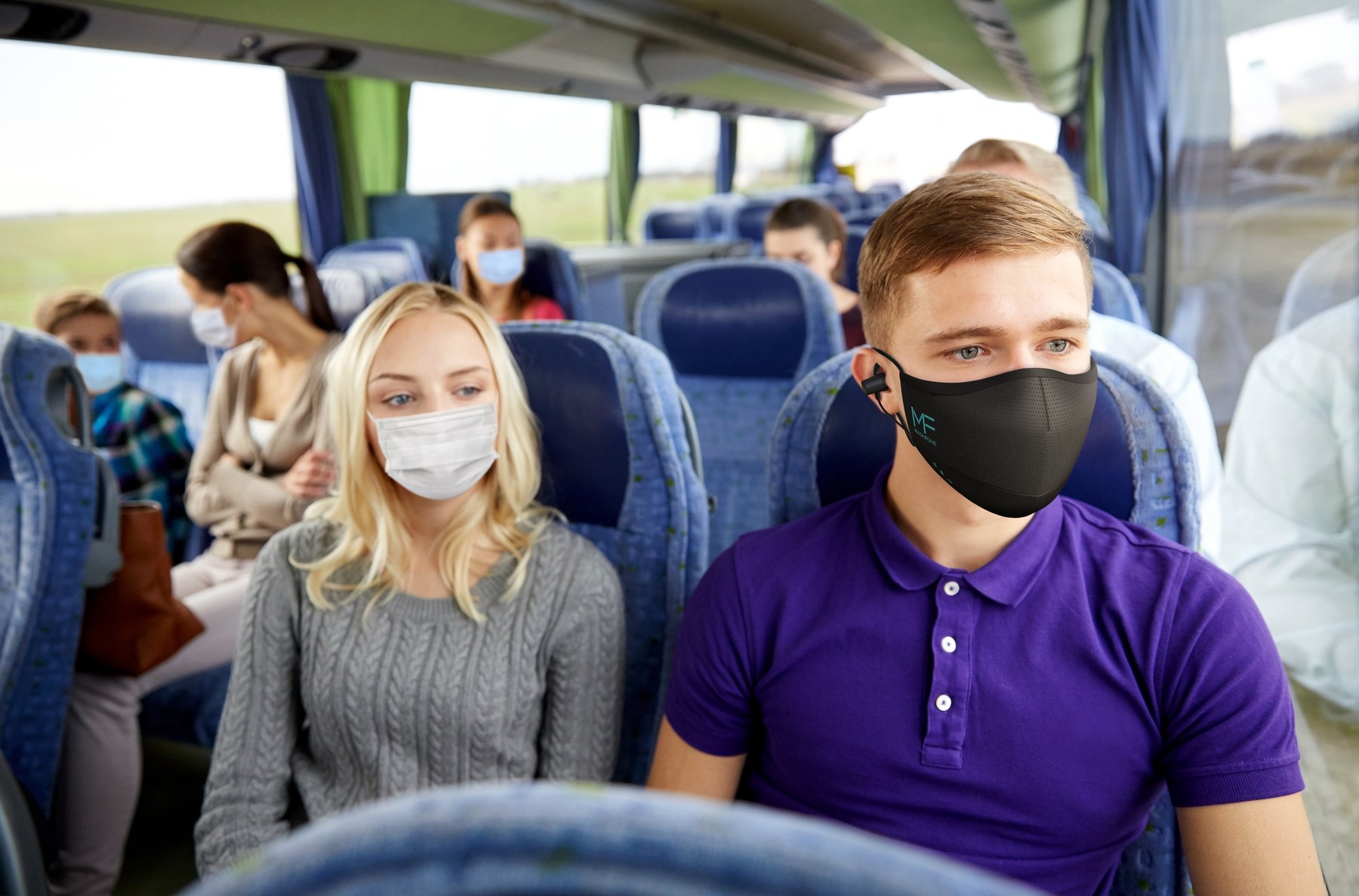 Passenger wearing MaskFone on a coach